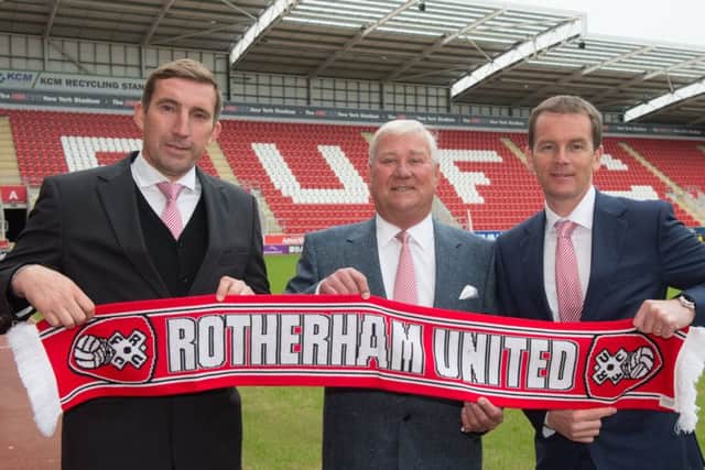 Alan Stubbs,, left, and his assistant John Doolan, flank Rotherham chairman Tony Stewart. Stubbs was sacked after just 14 games