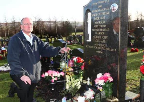 John Hood at the grave of his daughter Janet and grandson Michael who were murdered on December 28th 2013.