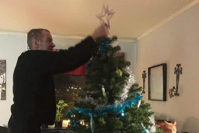 Jimmy helping decorate the tree. Picture: Annis Lindkvist