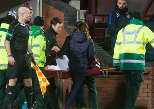 Callum Paterson is stretchered from the Tynecastle pitch. Pic: Ian Georgeson