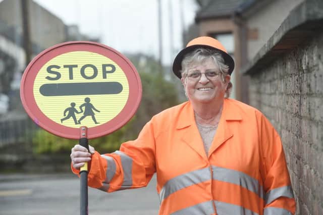 Rhona Ritchie is in the New Year's honours list having served as a lollipop lady for 40 years. Picture: Greg Macvean/TSPL