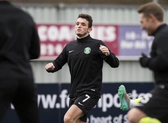 John McGinn took part in the warm-up at the Falkirk Stadium and could return for Hibs against Dundee Utd. Pic: SNS