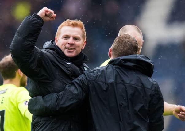 Head coach Neil Lennon salutes the Hibs fans after his side picked up a crucial win against Falkirk