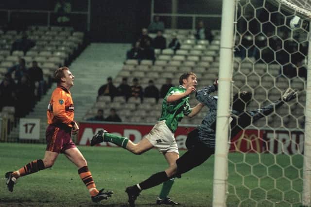 Keith Wright finishes off a cross for Hibs against Motherwell in 1995