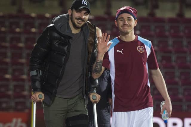 Paterson, left, with fellow sidelined Hearts player Sam Nicholson at Hearts' game against Aberdeen last Friday. Pic: SNS