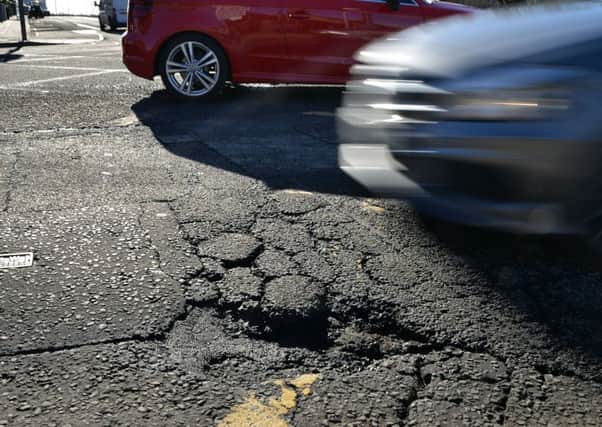 The council has faced a compensation claim for someone injured by a pothole while sitting in a car.