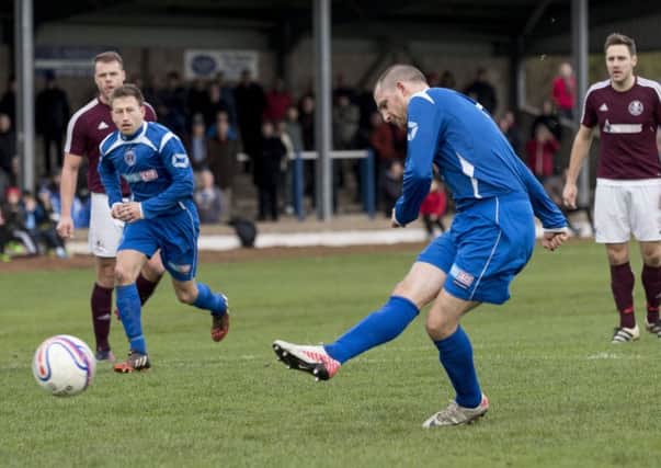 Bo'ness player Will Snowdon misses from the penalty spot
