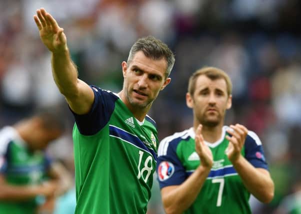 Hearts have offered Aaron Hughes a short-term deal while the club hope to sign his Northern Ireland team-mate Niall McGinn, right, on a pre-contract agreement