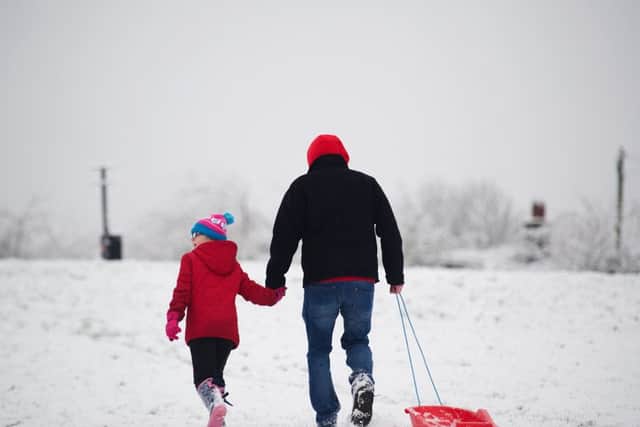 East Kilbride. The Hicks family play in the snow. Picture: John Devlin.