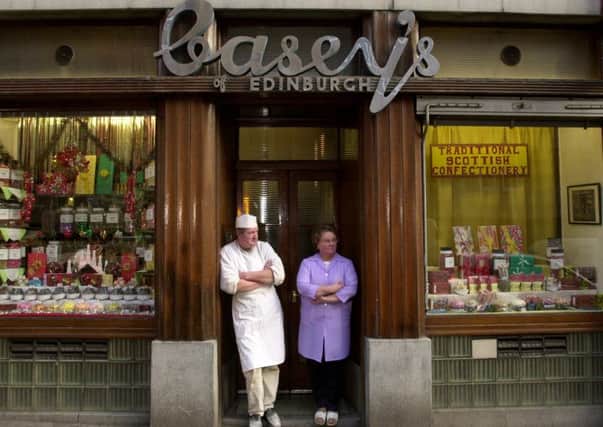 Bill and Helen Teviotdale, owners of Casey's sweet shop on St Mary's Street, stand outside their shop in 2002. Picture: Rob McDougall/TSPL