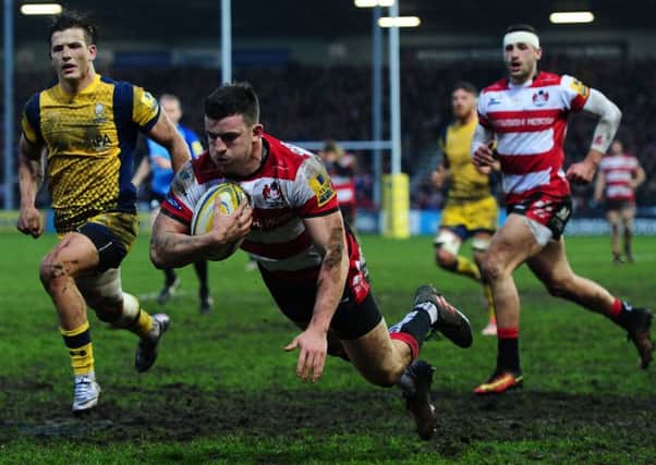 Matt Scott dives over the line for his second try for Gloucester against near rivals Worcester