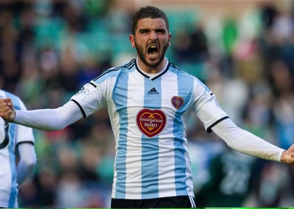 Alim Ozturk roars with delight after scoring a last-gasp 40-yard screamer against Hibs in 2014