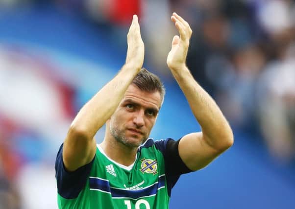 Aaron Hughes has signed until the end of the season