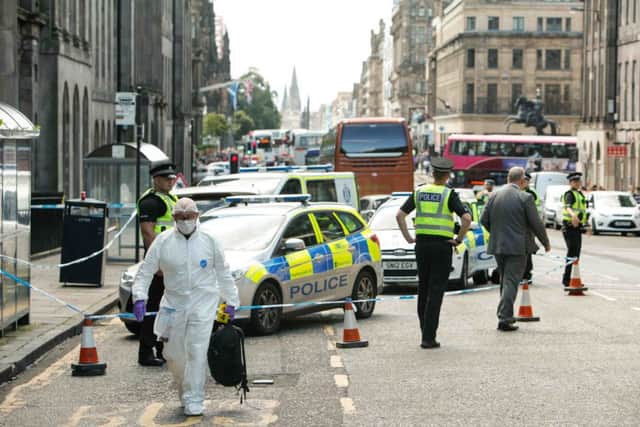 Police attend after the attack on Waterloo Place.