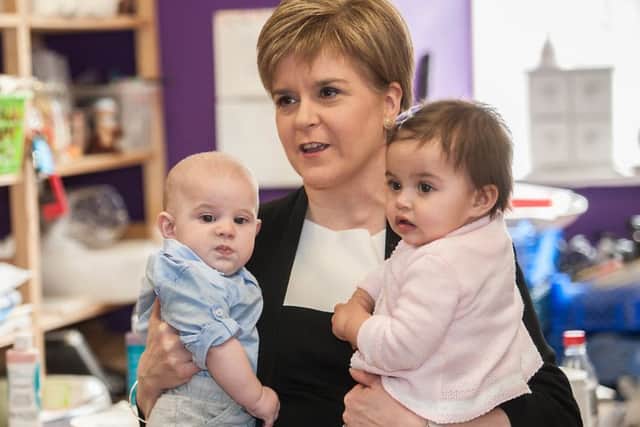 First Minister Nicola Sturgeon launches the Baby Box scheme with the help of little Leo Donegan and Nina Fredricks. Picture: John Devlin