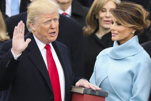 Donald Trump is sworn in as the 45th president of the United States as Melania Trump looks on. Picture: AP
