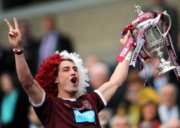 Rudi Skacel parades the Cup in front of the Hearts fans after scoring a double in the 5-1 demolition of Hibs