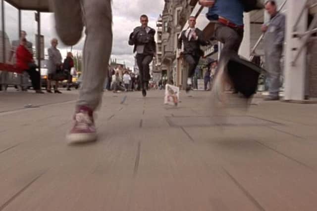The famous opening scene features Renton and Spud running down Princes Street after stealing goods from John Menzies. Picture: Film4.