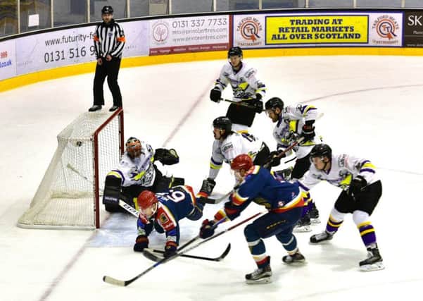 The Capitals apply pressure. Garret Milan (no 65) and Karel Hromas (in foreground) do their best to beat the Manchester defence. Picture: Jan Orkisz/SMP