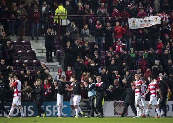 The Bonnyrigg Rose players applaud their fans at full-time