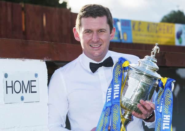 Shaken not stirred: Robbie Horn gets his hands on the Scottish Cup