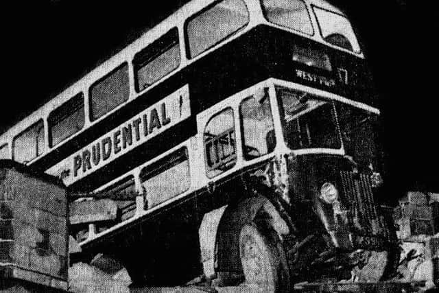 The Edinburgh Corporation bus hangs precariously over the edge of the bridge. Picture: TSPL