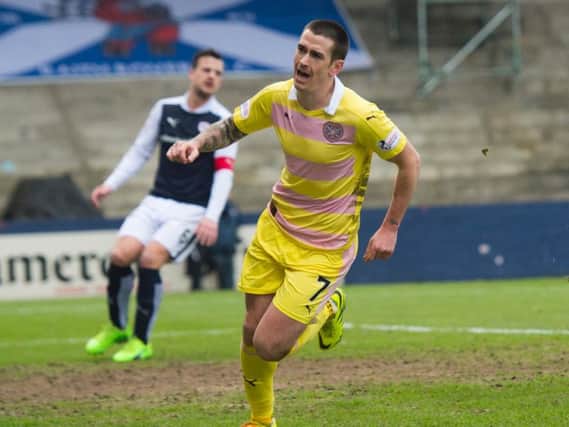 Jamie Walker runs off to celebrate after putting Hearts 1-0 ahead