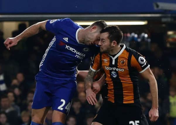 Gary Cahill and  Ryan Mason clash heads. Pic: Getty Images