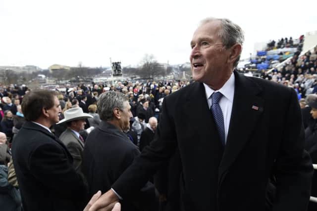 Dubya greets well-wishers on inauguration day. Picture: Getty