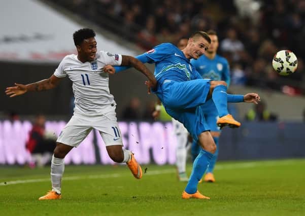 Andraz Struna battles with Englands Raheem Sterling during a Euro 2016 qualifying match at Wembley. Picture: Getty Images