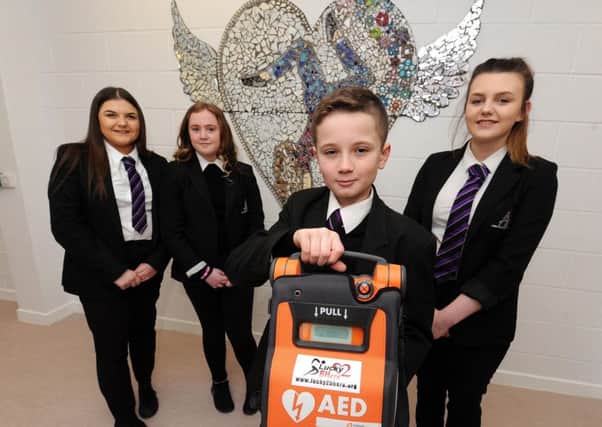 Armadale Academy students with a defibrillator. Picture; Lisa Ferguson