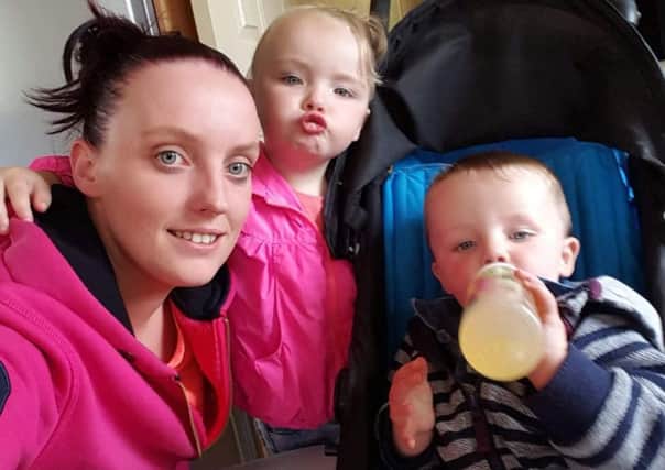 Zoe Thomson  with her children. They are currently in emergency B&B accommodation where they all - along with zoe's partner - share the one room with no cooking facilities. Contributed