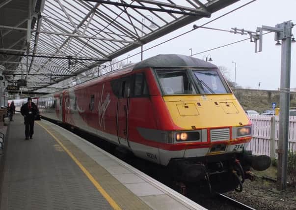 Virgin train to London stops at Berwick Upon Tweed railway station on the East Coast mainline