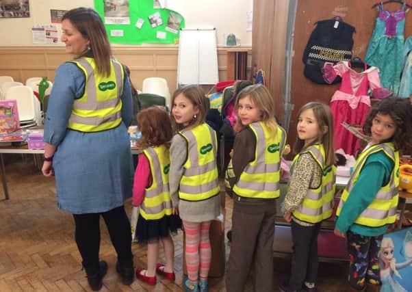 Mrs Lisa Hodkinson, Katie Hodkinson, Anna Hodkinson, Rhona Beasley, Ines Martin and Cora Scott sport the new high visibility vests donated to the 2nd Dalkeith Rainbows and 5th Dalkeith Brownies by the Dalkeith Specsavers store.