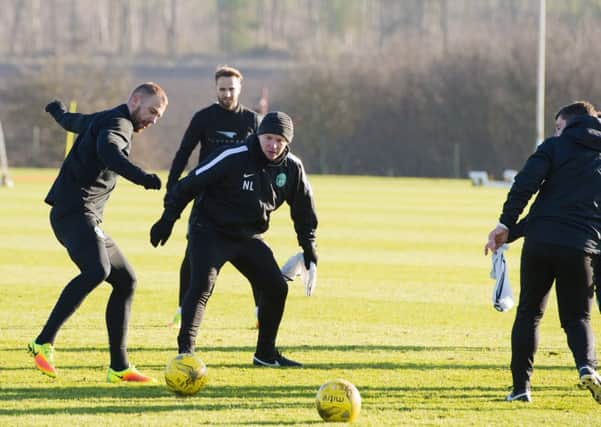 Head coach Neil Lennon got involved in the action as Hibs trained at East Mains