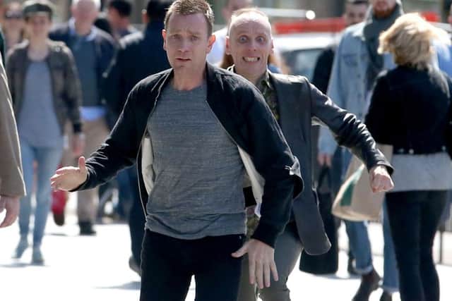 Actors Ewan McGregor and Ewan Bremner running through the streets of Edinburgh. Jane Barlow/PA Wire