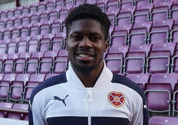Dylan Bikey poses at Tynecastle after agreeing to join Hearts. Pic: Hearts FC