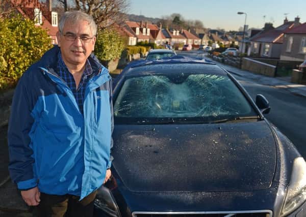 Alon Palmer woke to find his windscreen smashed.  Pic: Neil Hanna