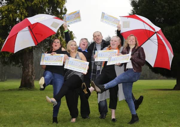 Postcode Millions winners pictured at Melville Castle.