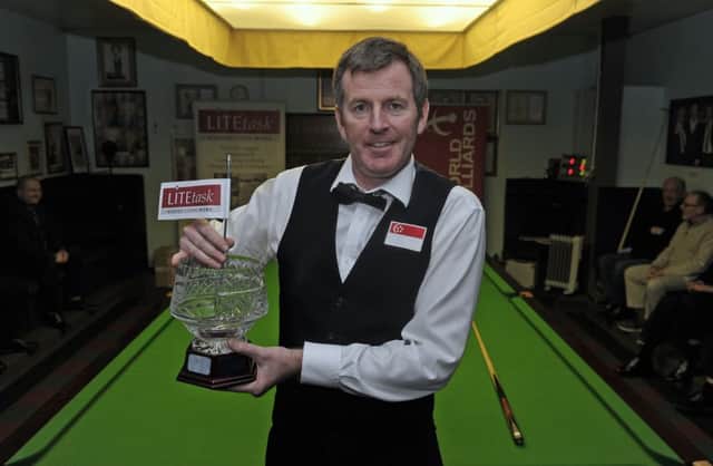 Peter Gilchrist shows off his trophy at the Corn Exchange. Pic: Neil Hanna
