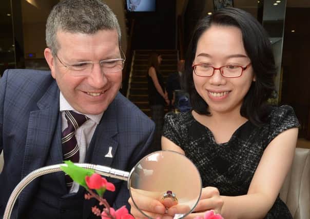 Edinburgh Airport chief Gordon Dewar with Kathy Xin Luo, Laing's Chinese business development manager. Picture: Jon Savage