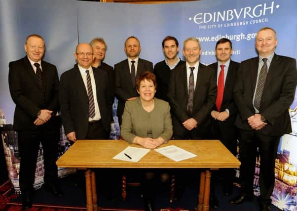 City of Edinburgh Council Transport Convener Councillor Lesley Hinds was joined by representatives from utility companies in signing a public pledge. Picture: Lisa Ferguson