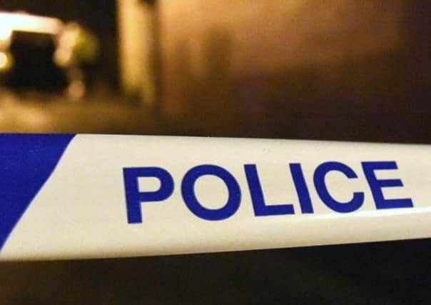 Police are investigating after a man fell from a window
