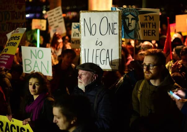 Protesters demonstrate against Donald Trump's travel ban at The Mound. Picture: Getty
