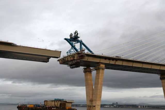The final deck piece of the Queensferry Crossing over the Firth of Forth, sits on a barge ahead of it being lifted into position. Picture; Andrew Milligan/PA Wire