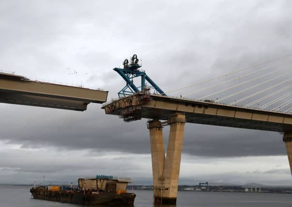 The final deck piece of the Queensferry Crossing over the Firth of Forth, sits on a barge ahead of it being lifted into position. Picture; Andrew Milligan/PA Wire