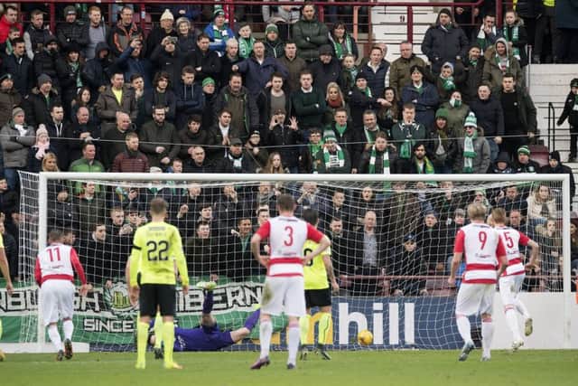 Hoskins (No.5) scores from the penalty spot against Hibs