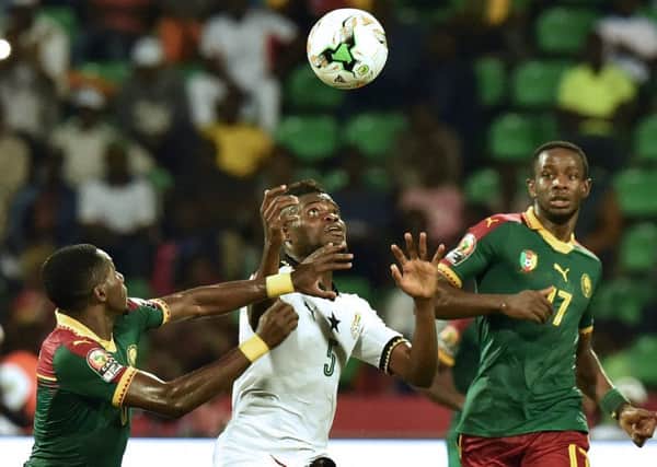 Arnaud Djoum, right, in action against Ghana
