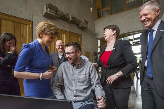 Gordon shares a laugh with the party leaders at Holyrood. Picture: Steven Scott Taylor