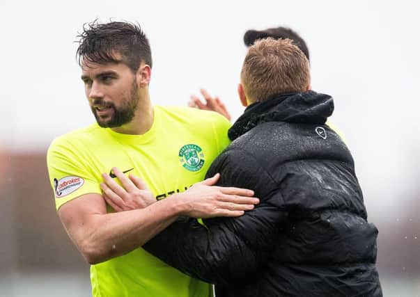 Darren McGregor gets a congratulatory hug from boss Neil Lennon after the victory over Falkirk